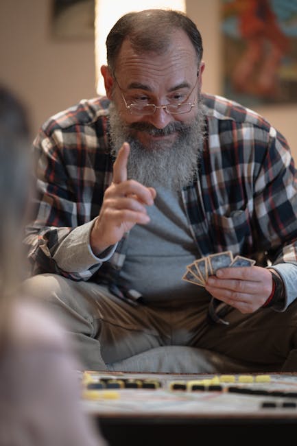 Happy senior man participating in an online yoga class on his laptop